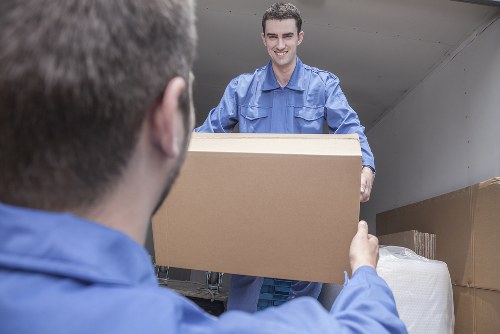 Local removals van outside a Sudbury home with packing boxes