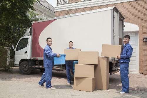 Professional movers handling furniture carefully inside a Sudbury home