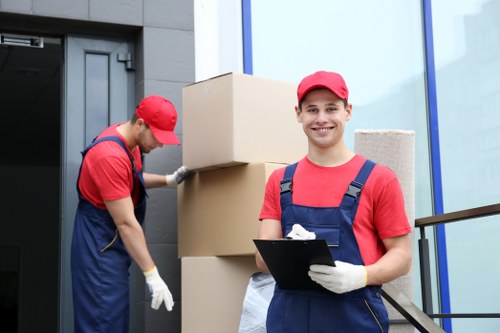 Mover using PPE while handling furniture during a Sudbury removal