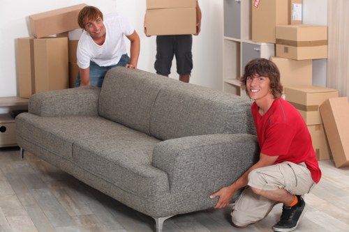Moving team transporting office desks and IT equipment