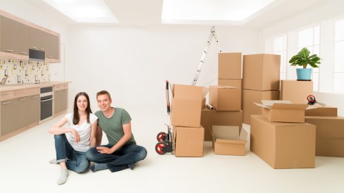 Man and van removals team loading furniture for a Sudbury move