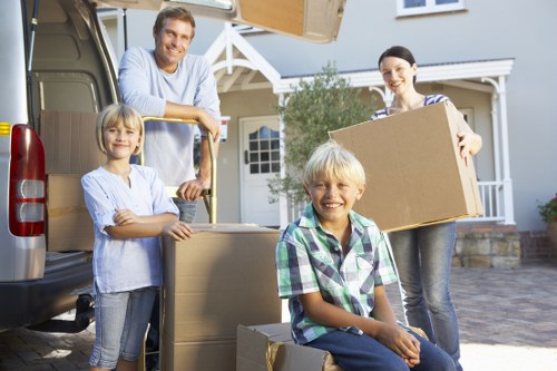 Careful lifting of boxes and furniture during a Sudbury relocation