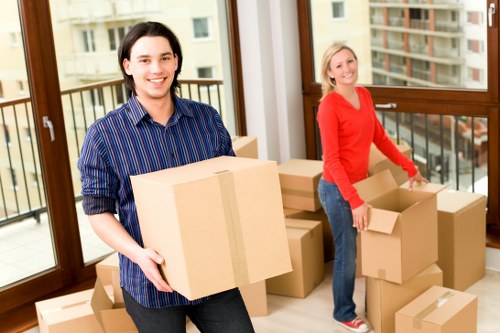 Packed moving boxes and furniture ready for transport
